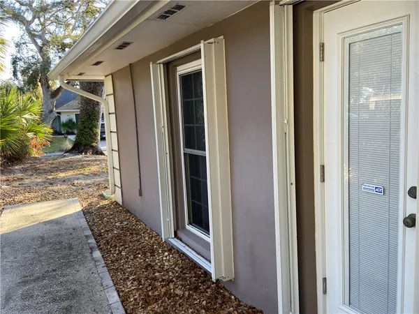 a view of a door and a window