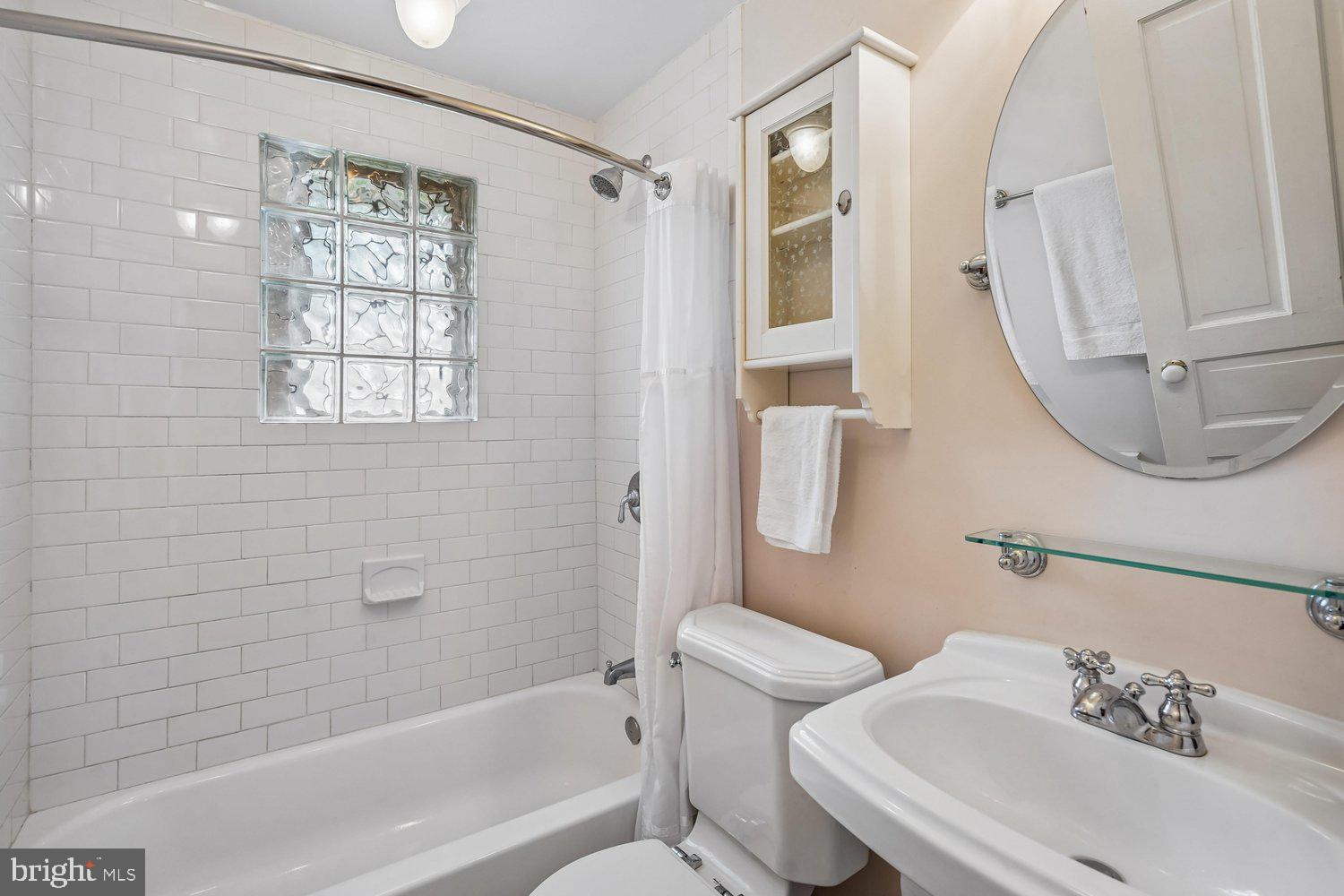 16 Maple Avenue Washington Grove, MD 20880 - Photo 38 of 58 Charming bathroom with modern touches.