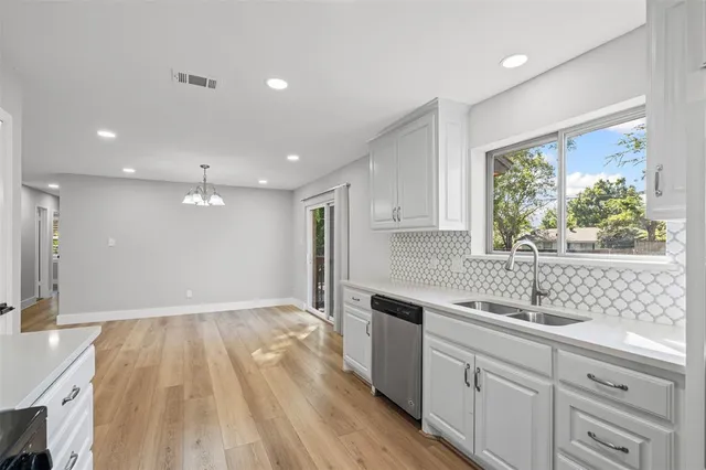 a bathroom with a sink a mirror and a bathtub