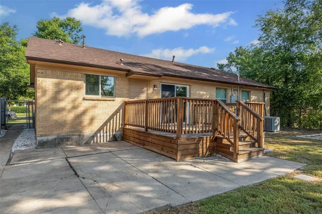 a view of a house with a yard next to a yard