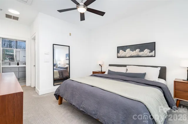 a bathroom with a double vanity sink toilet and shower
