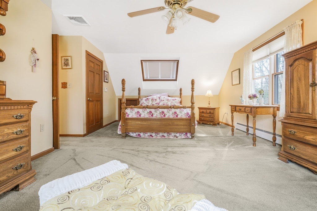 7 Bow Drive Acushnet, MA 02743 - Photo 33 of 42 a view of a spacious bedroom with a bed and cabinet