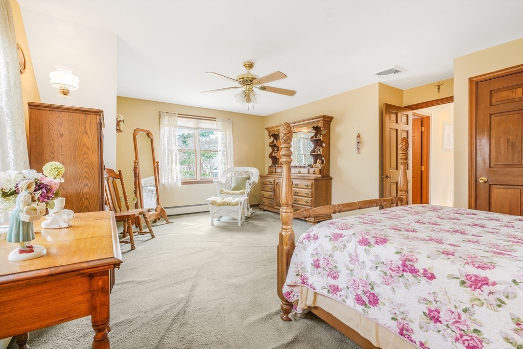 7 Bow Drive Acushnet, MA 02743 - Photo 34 of 42 a bedroom with a bed and large windows