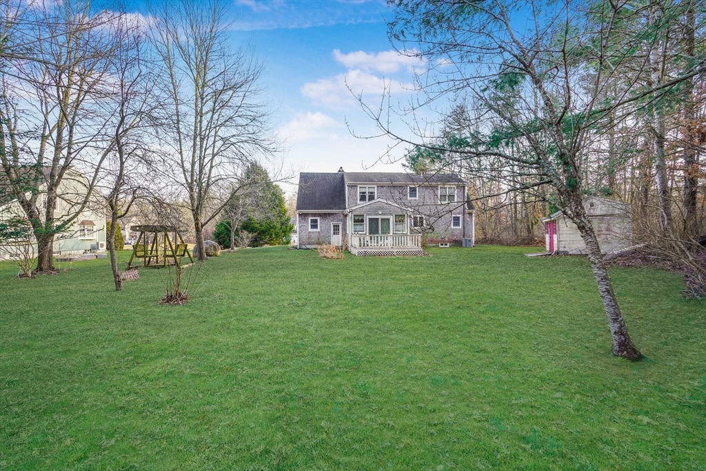 7 Bow Drive Acushnet, MA 02743 - Photo 8 of 42 a view of a building with a yard