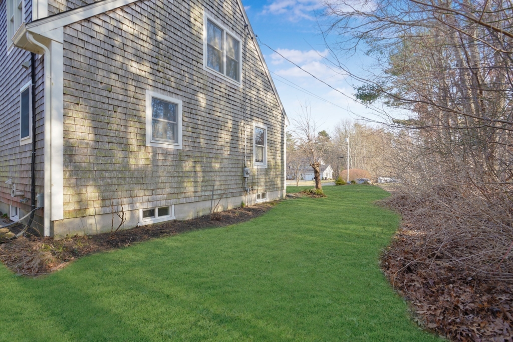 7 Bow Drive Acushnet, MA 02743 - Photo 9 of 42 a view of a backyard with plants and large trees