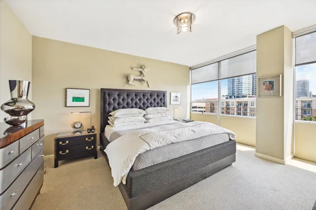 a bedroom with a bed and a night stand