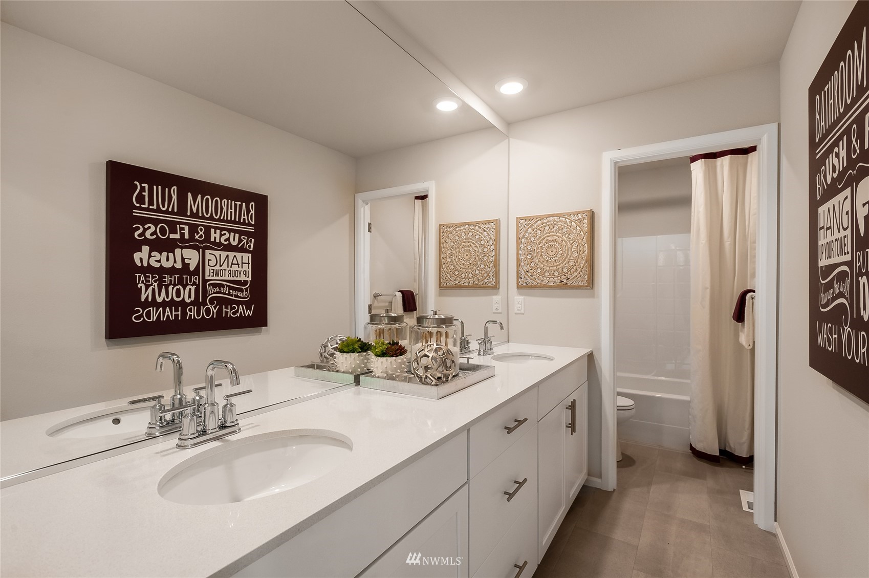 4028 234th Place Southeast, Unit 64 Bothell, WA 98021 - Photo 13 of 19 a bathroom with a double vanity sink mirror and double