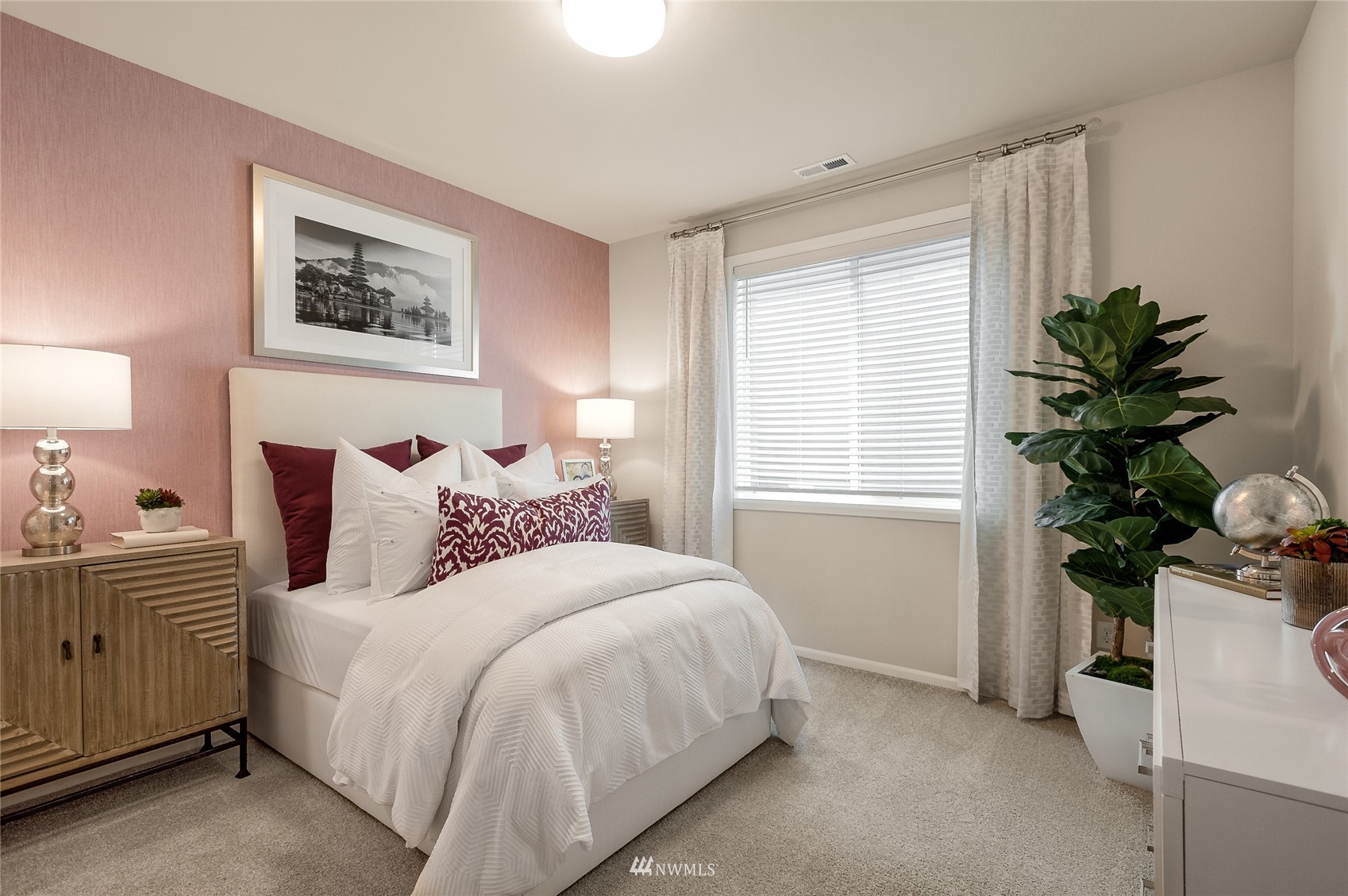 4028 234th Place Southeast, Unit 64 Bothell, WA 98021 - Photo 5 of 19 a bedroom with a bed and a potted plant