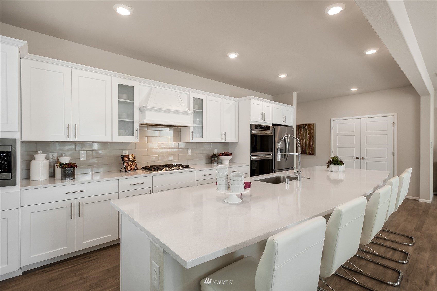 4028 234th Place Southeast, Unit 64 Bothell, WA 98021 - Photo 7 of 19 a kitchen with stainless steel appliances a sink a stove a refrigerator and cabinets