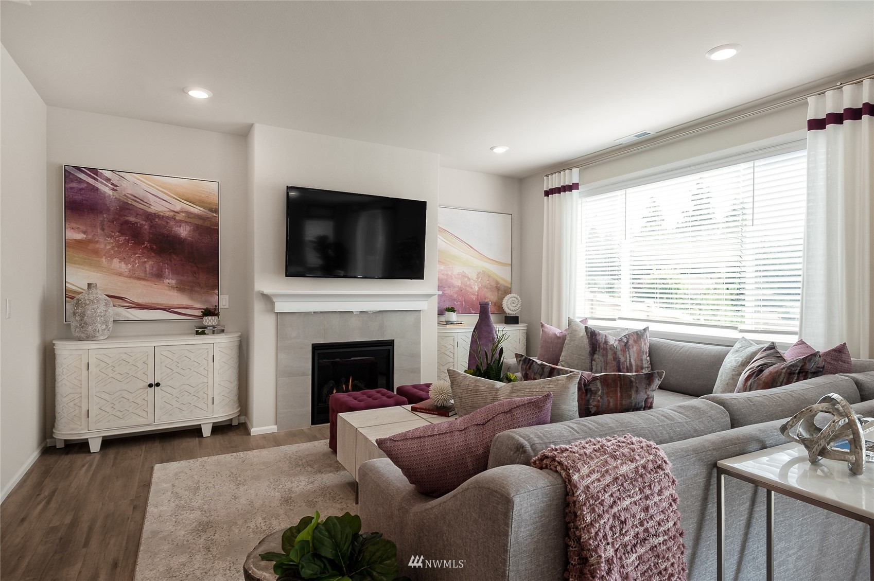 4028 234th Place Southeast, Unit 64 Bothell, WA 98021 - Photo 9 of 19 a living room with furniture a flat screen tv and a fireplace