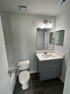 283 Gardner Lane, Unit D Kissimmee, FL 34743 - Photo 11 of 12 a bathroom with a sink toilet and mirror