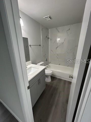 283 Gardner Lane, Unit D Kissimmee, FL 34743 - Photo 12 of 12 a bathroom with a sink a toilet and shower