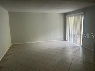 283 Gardner Lane, Unit D Kissimmee, FL 34743 - Photo 7 of 12 a view of an empty room and window