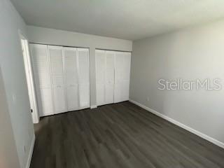 283 Gardner Lane, Unit D Kissimmee, FL 34743 - Photo 8 of 12 a view of an empty room with wooden floor