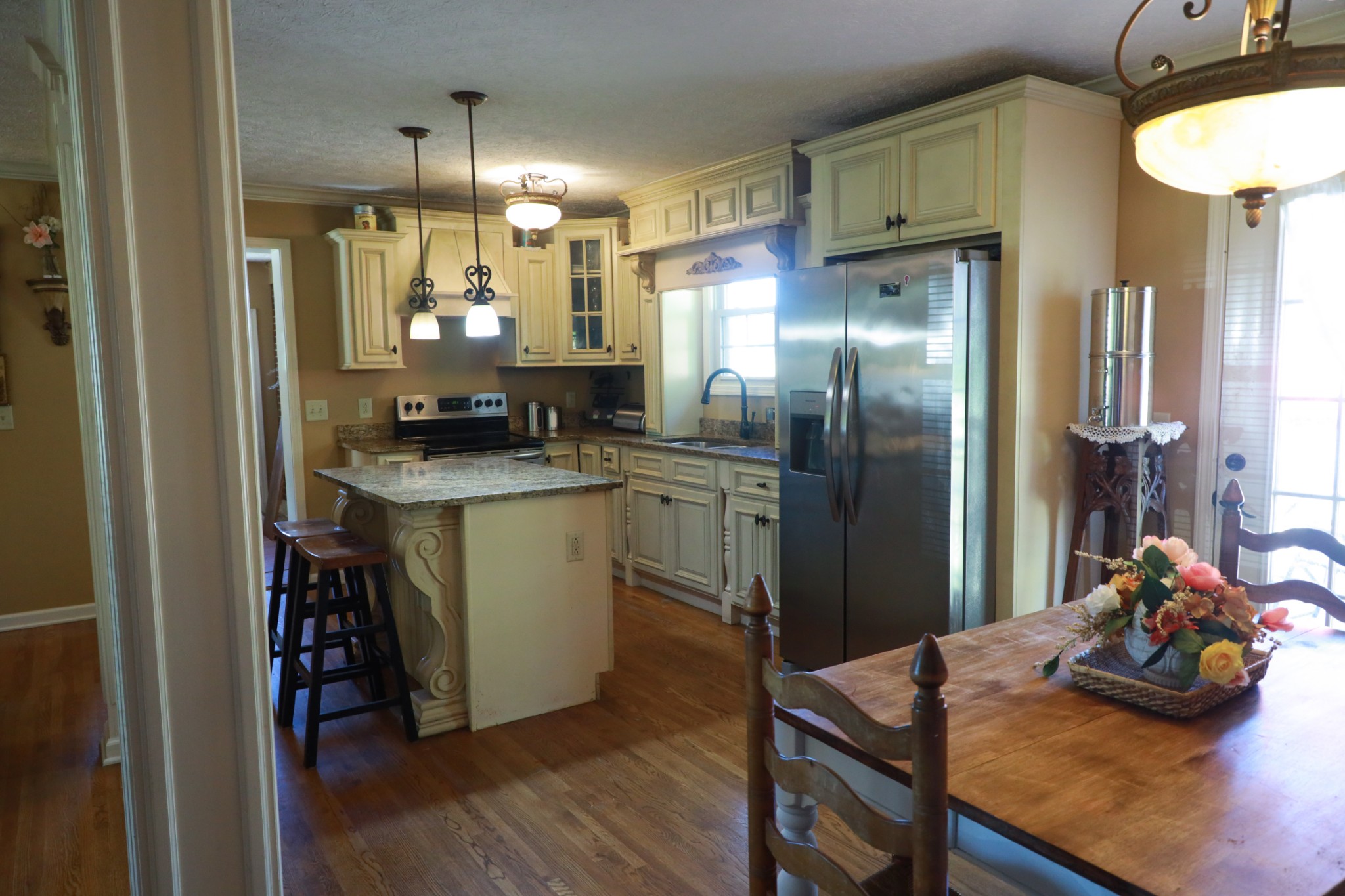 12354 Owens Chapel Road Springfield, TN 37172 - Photo 16 of 51 a kitchen with refrigerator a sink and wooden floor