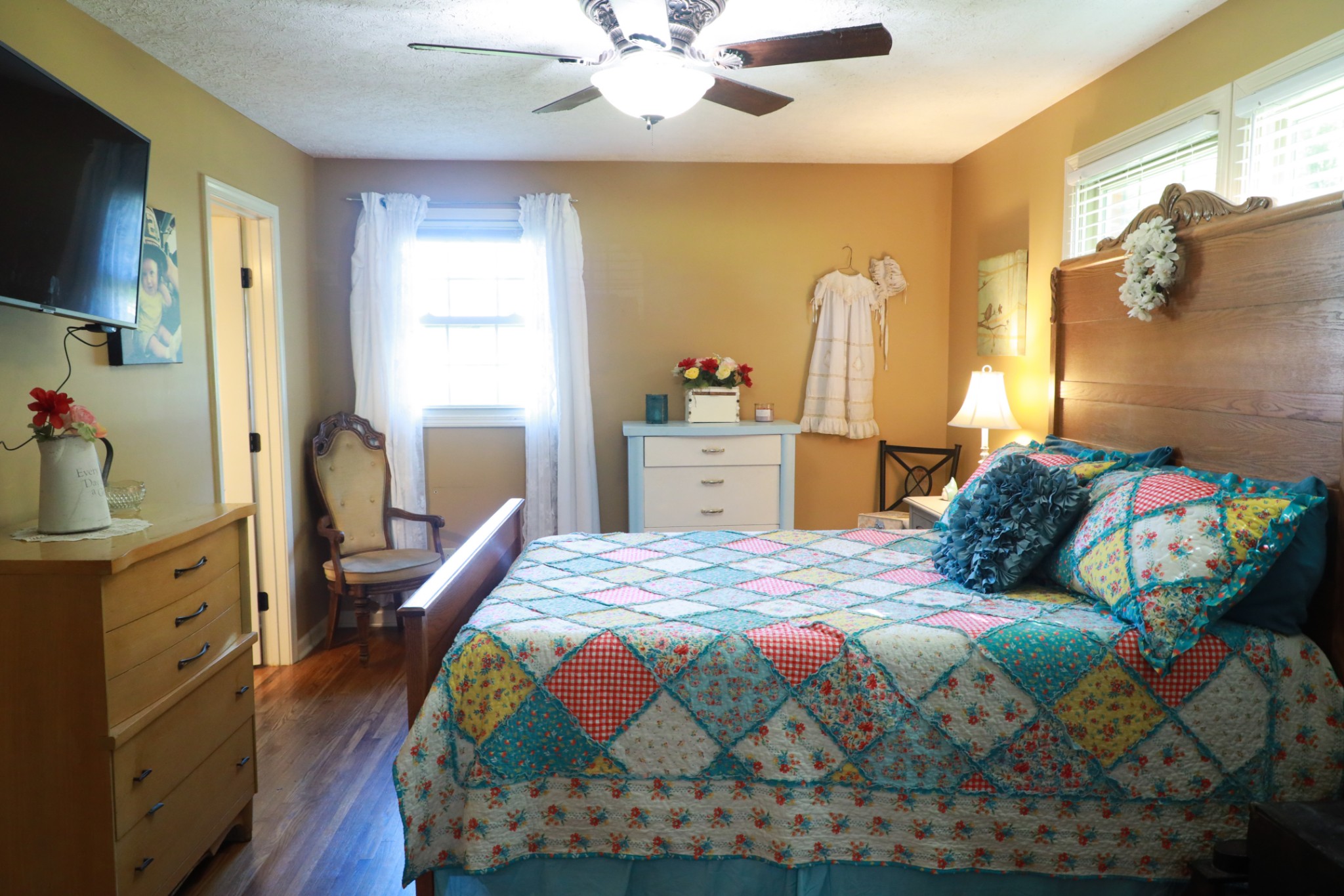 12354 Owens Chapel Road Springfield, TN 37172 - Photo 20 of 51 a bedroom with a bed and a chandelier