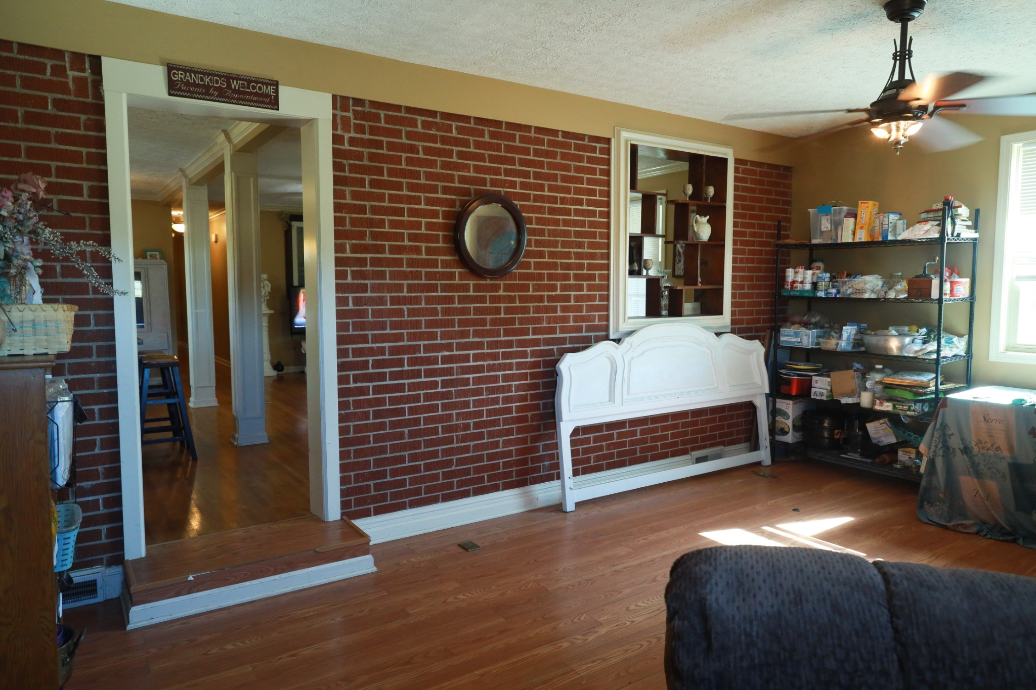 12354 Owens Chapel Road Springfield, TN 37172 - Photo 36 of 51 a bedroom with a bed and a chandelier