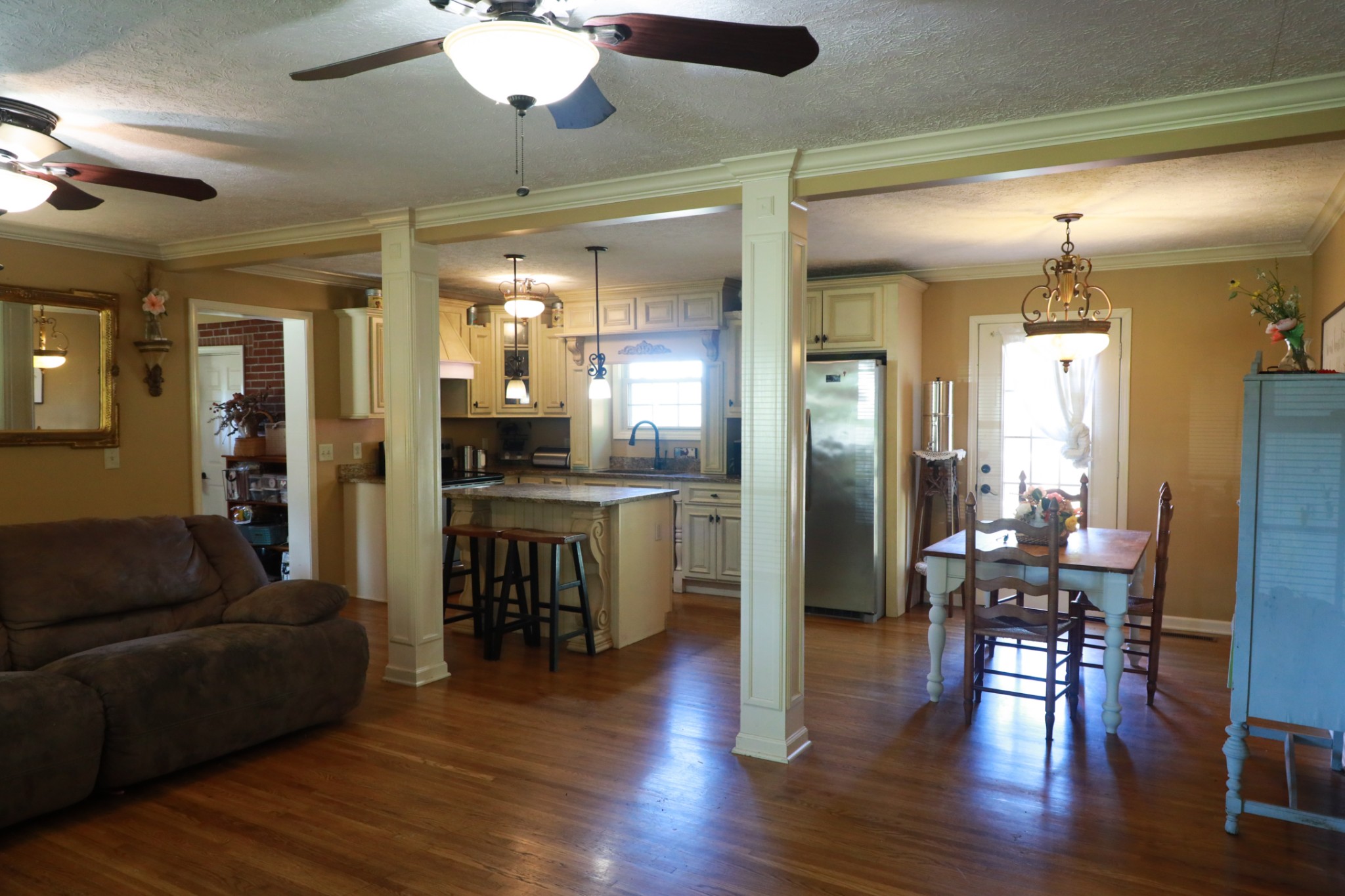 12354 Owens Chapel Road Springfield, TN 37172 - Photo 10 of 51 a living room with furniture dining table and wooden floors