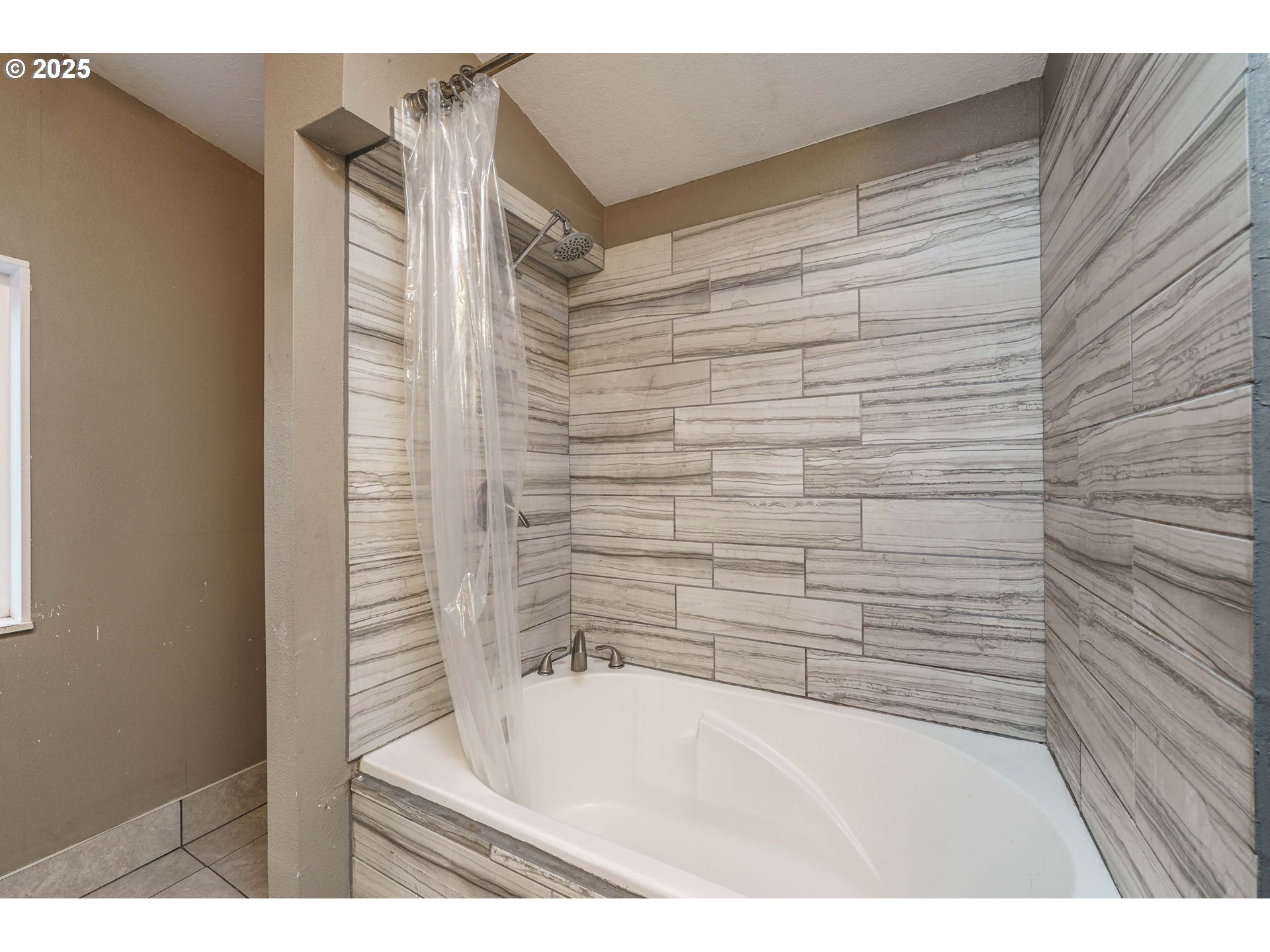 3777 Addy Street, Unit 17 Washougal, WA 98671 - Photo 17 of 25 a bathroom with a bathtub and shower