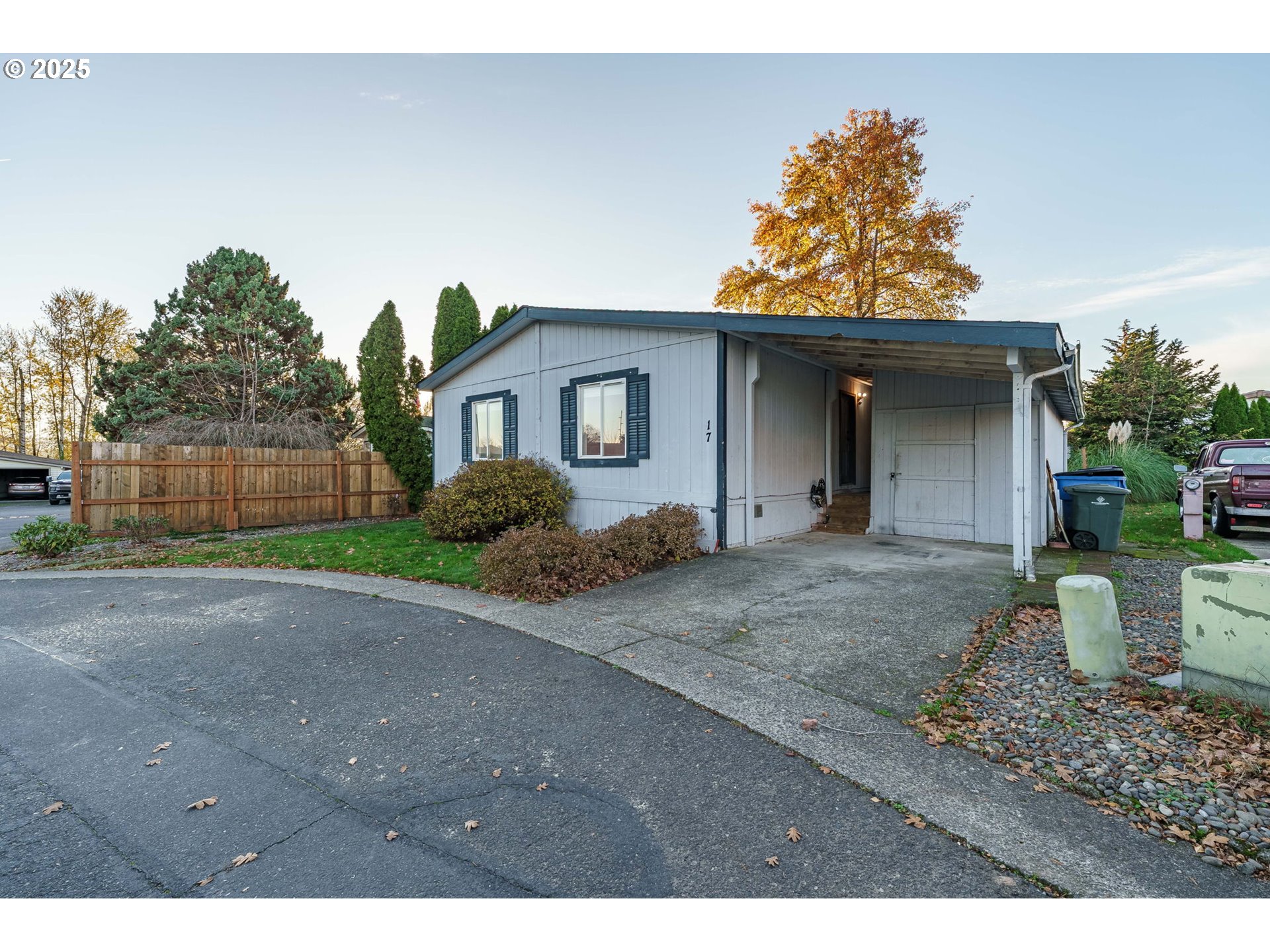 3777 Addy Street, Unit 17 Washougal, WA 98671 - Photo 3 of 25 a view of a house with a yard plants and a large tree