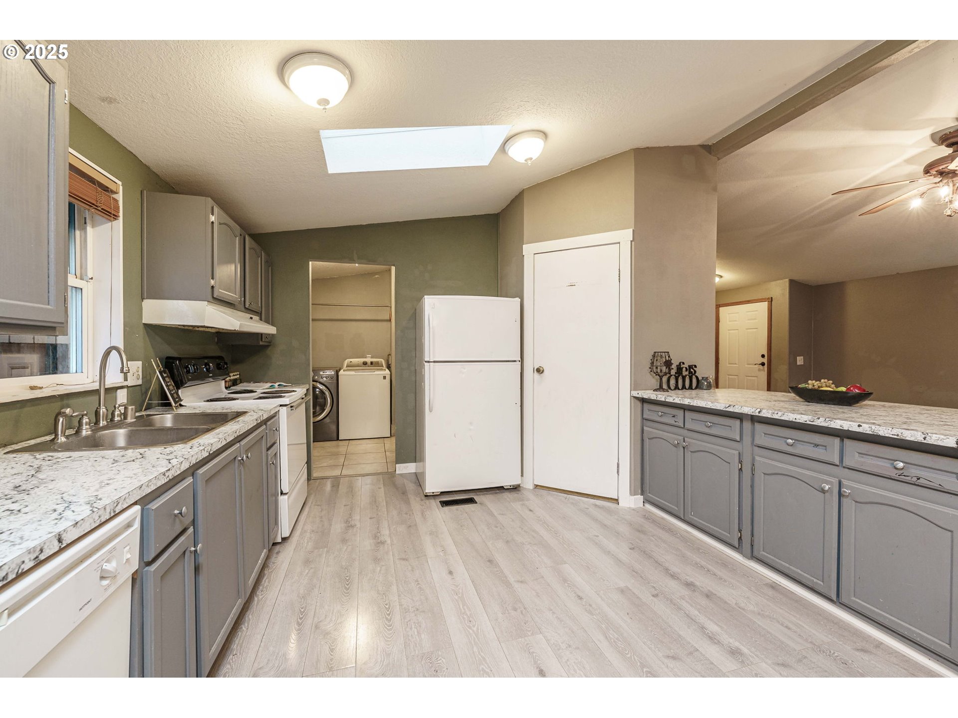 3777 Addy Street, Unit 17 Washougal, WA 98671 - Photo 8 of 25 a kitchen with a sink a refrigerator and a stove