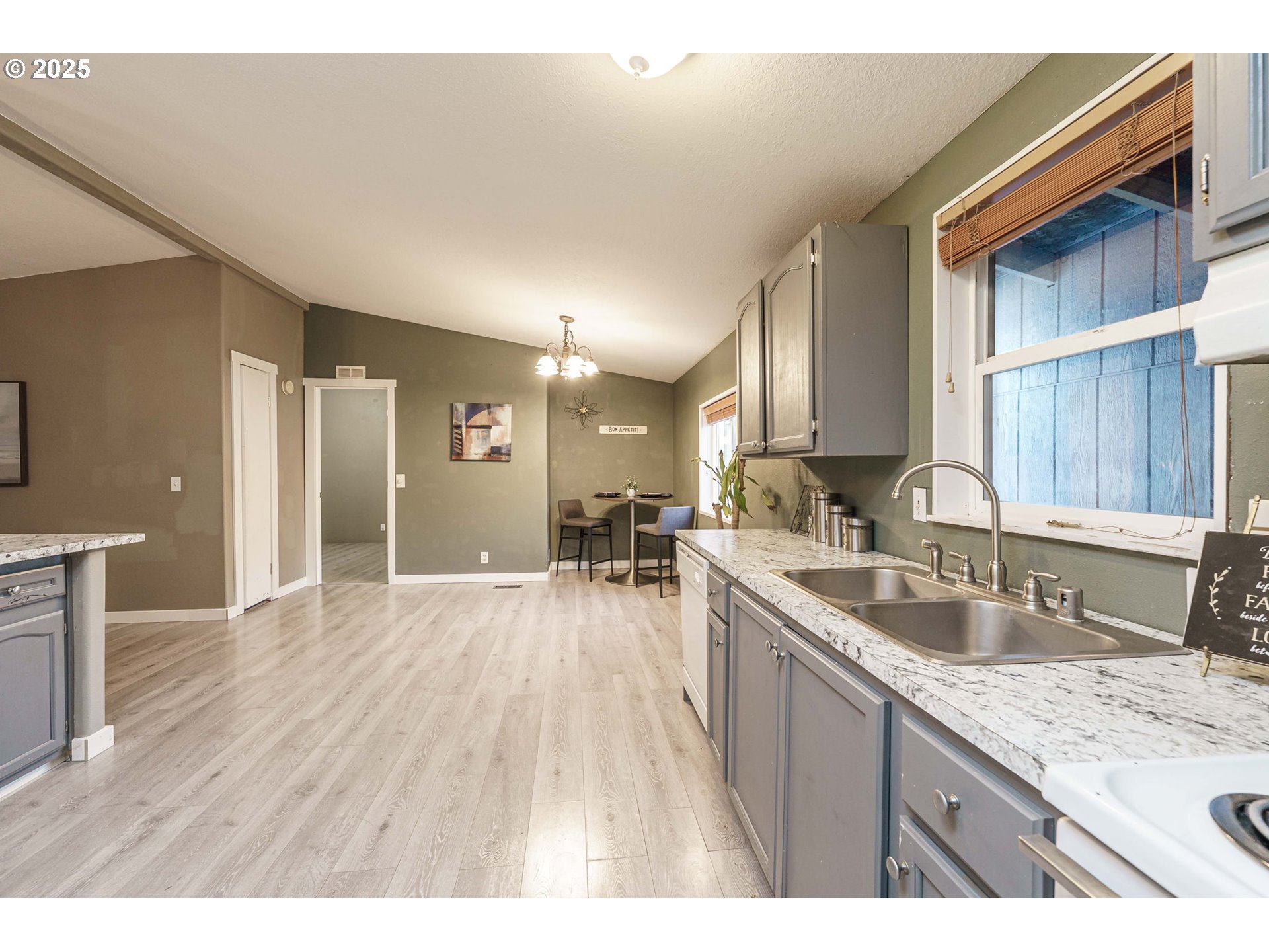3777 Addy Street, Unit 17 Washougal, WA 98671 - Photo 9 of 25 a kitchen with a sink and wooden cabinets