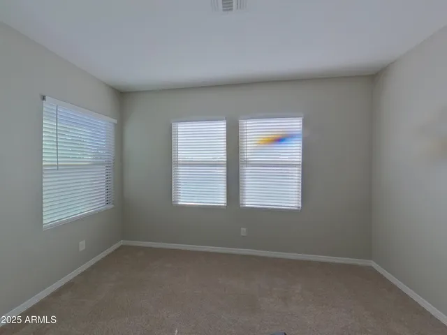 a kitchen with stainless steel appliances granite countertop a sink a stove and refrigerator