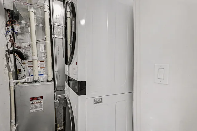 a close view of a utility room with dryer and washer