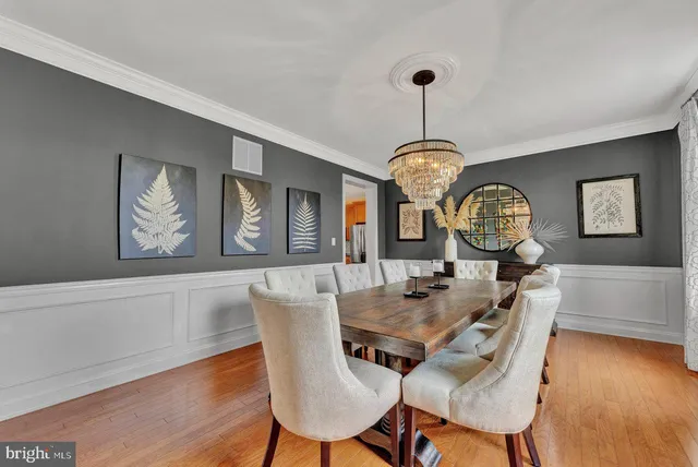 a living room with furniture a large window and a fireplace