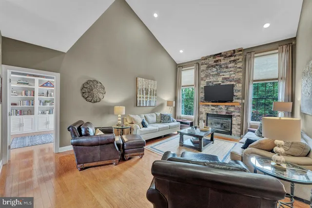 a view of living room with furniture and a fireplace