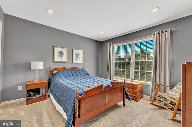 a bathroom with a double vanity sink a toilet and a mirror