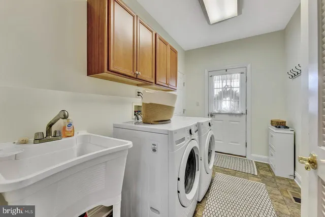 a view of a livingroom with furniture and staircase