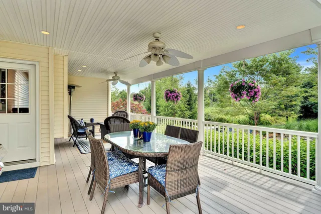 a view of a house with a backyard and a patio