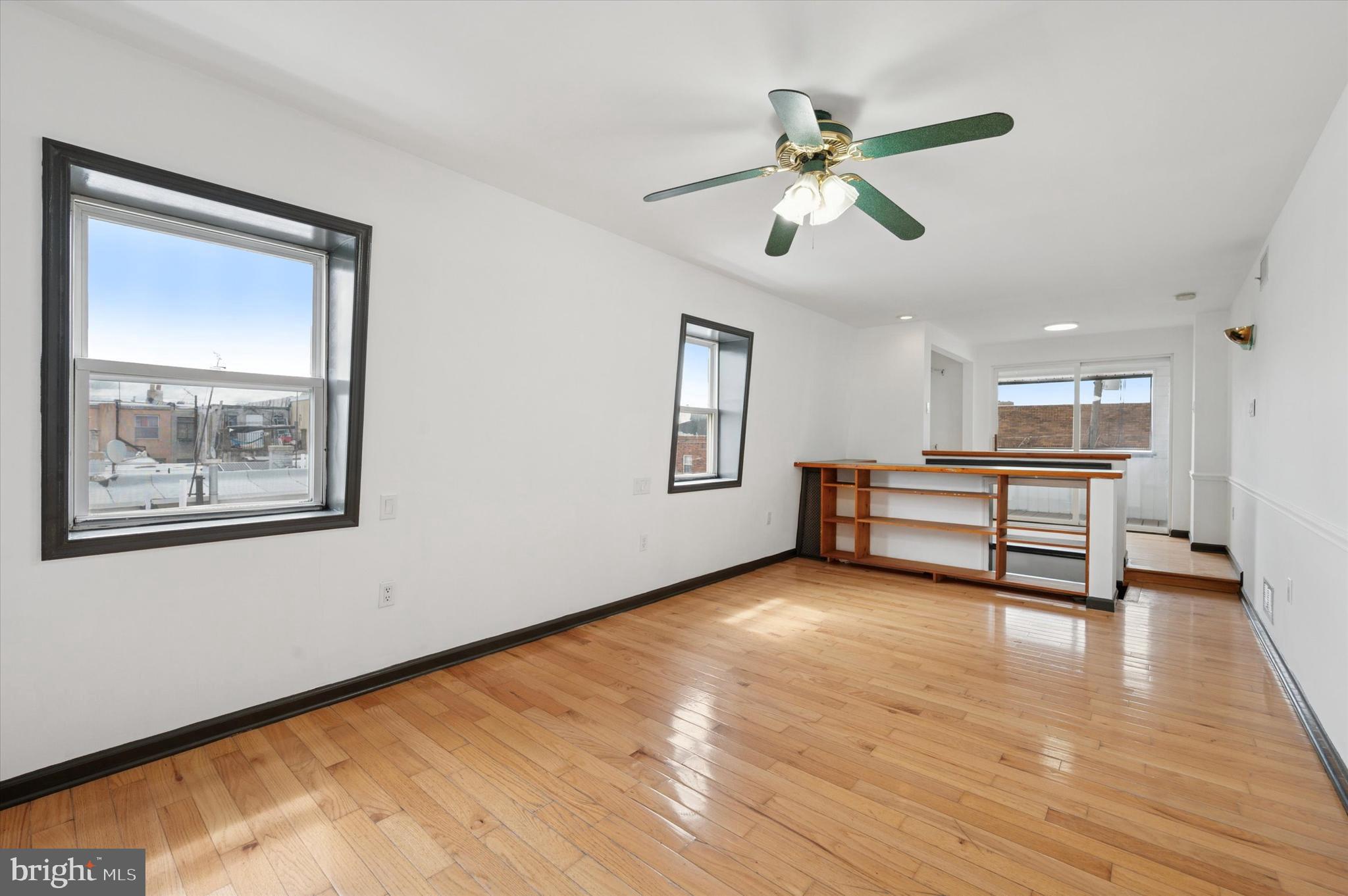 913 Tasker Street Philadelphia, PA 19148 - Photo 14 of 22 a view of livingroom with hardwood floor and ceiling fan