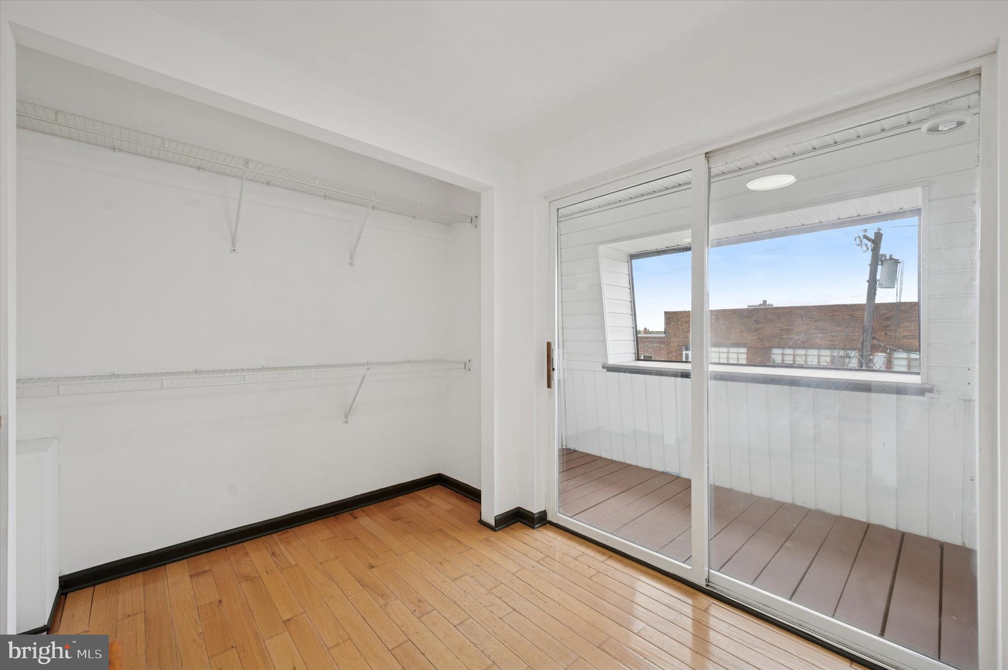 913 Tasker Street Philadelphia, PA 19148 - Photo 16 of 22 a view of a room with wooden floor