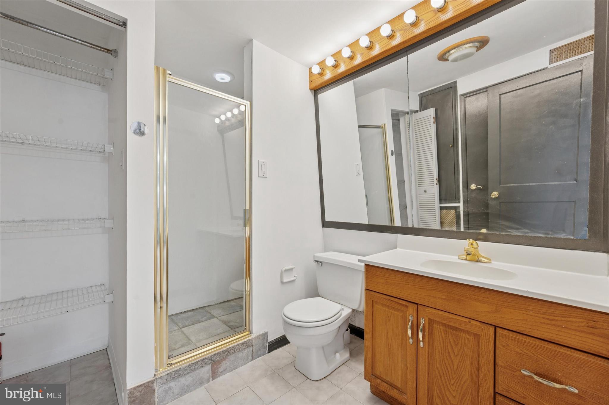 913 Tasker Street Philadelphia, PA 19148 - Photo 17 of 22 a bathroom with a toilet sink and shower
