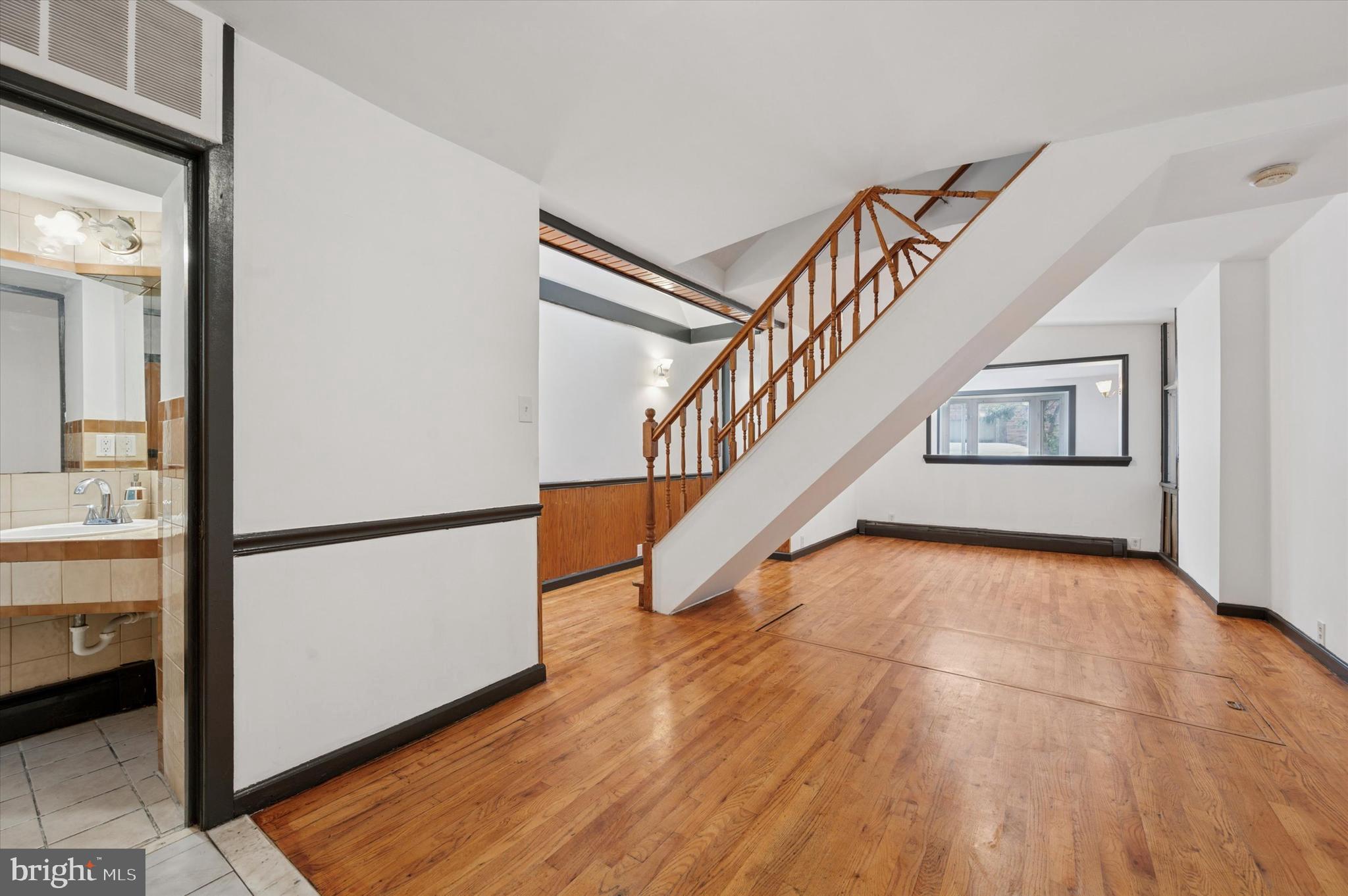 913 Tasker Street Philadelphia, PA 19148 - Photo 4 of 22 a view of entryway and hall with wooden floor