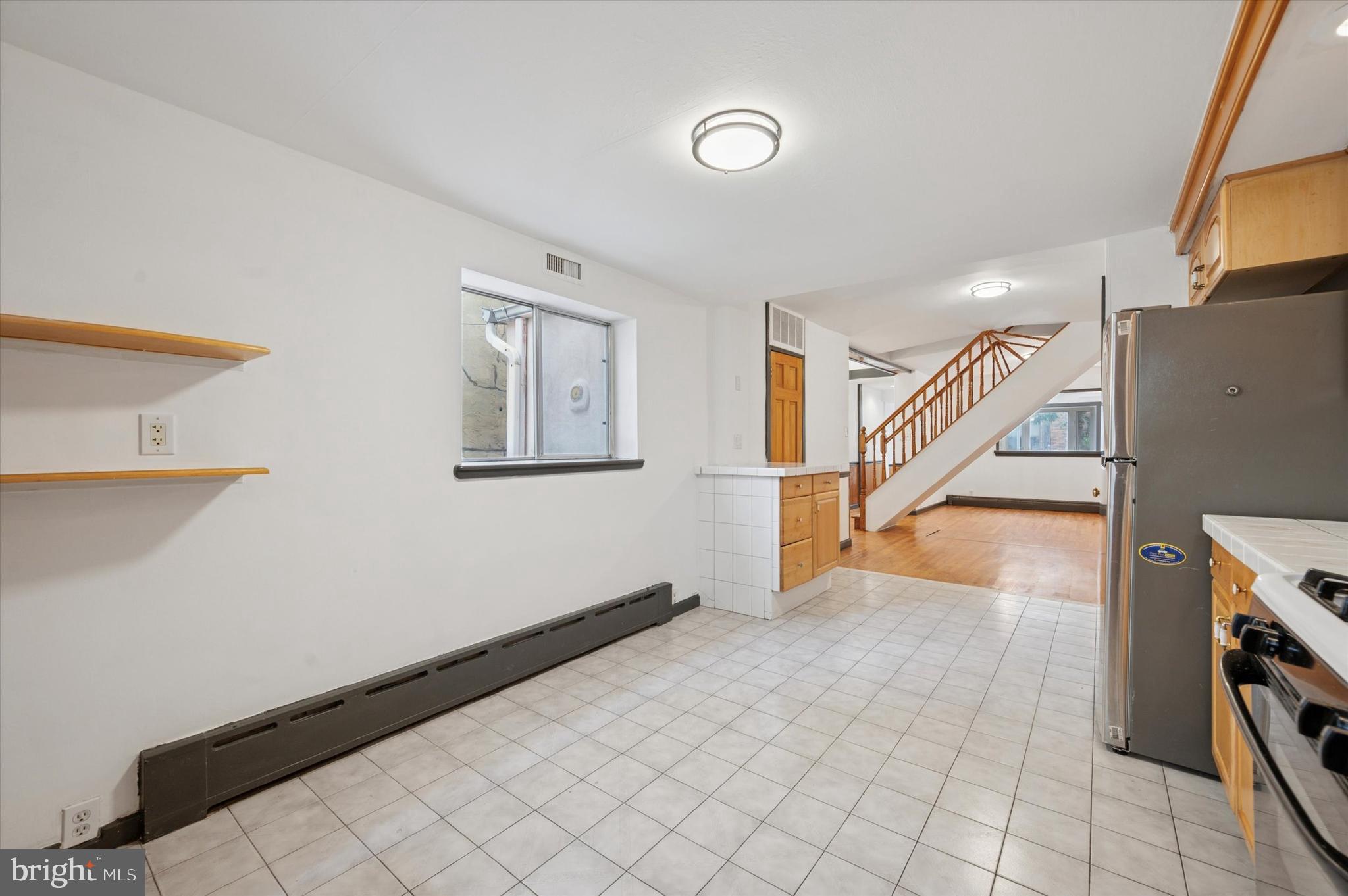 913 Tasker Street Philadelphia, PA 19148 - Photo 7 of 22 a view of entryway and hall with wooden floor