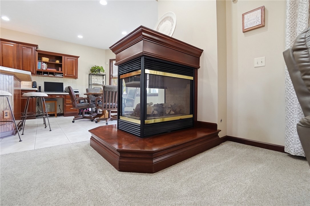 710 Governors Road Troy, OH 45373 - Photo 8 of 56 This inviting space features a unique fireplace, offering warmth and character to the room.