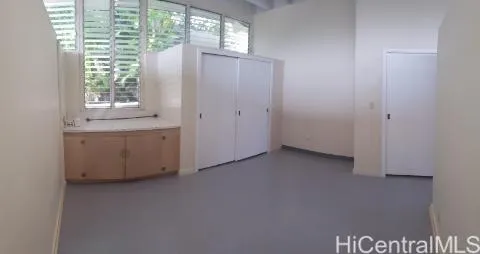 a view of an empty room with a window