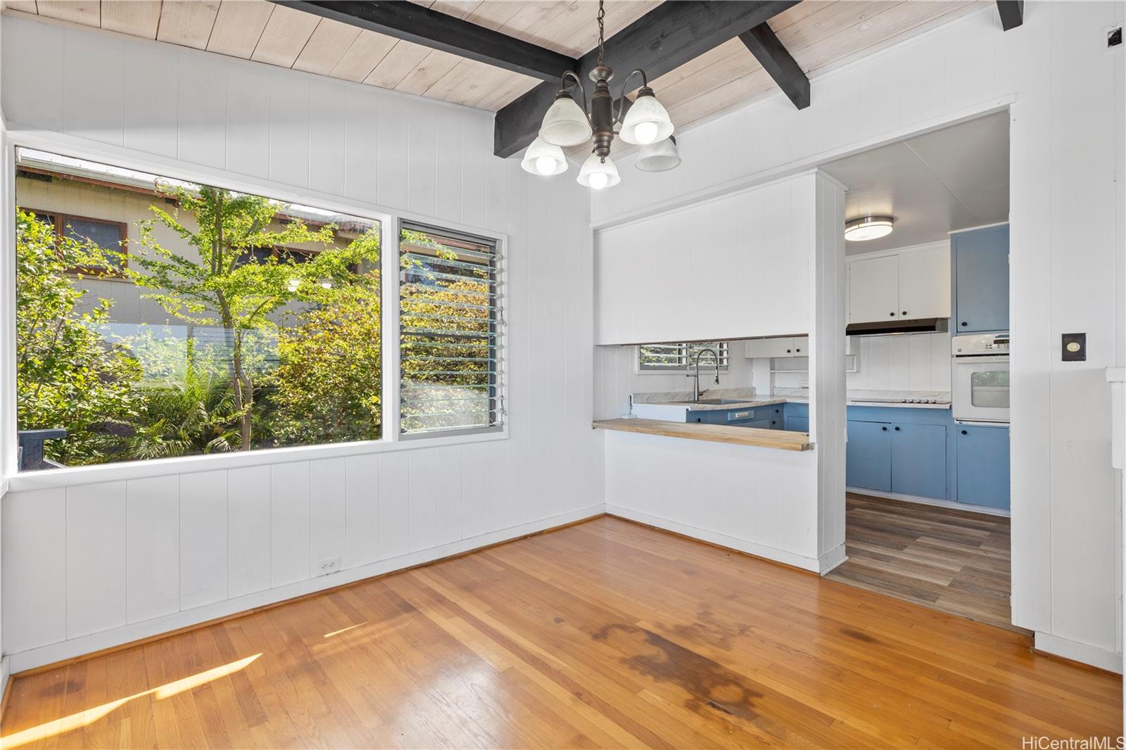 1554 Ala Amoamo Street Honolulu, HI 96819 - Photo 4 of 19 a view of a kitchen with a dishwasher and a large window