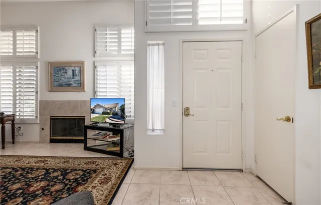 a living room with furniture wooden floor and a fireplace