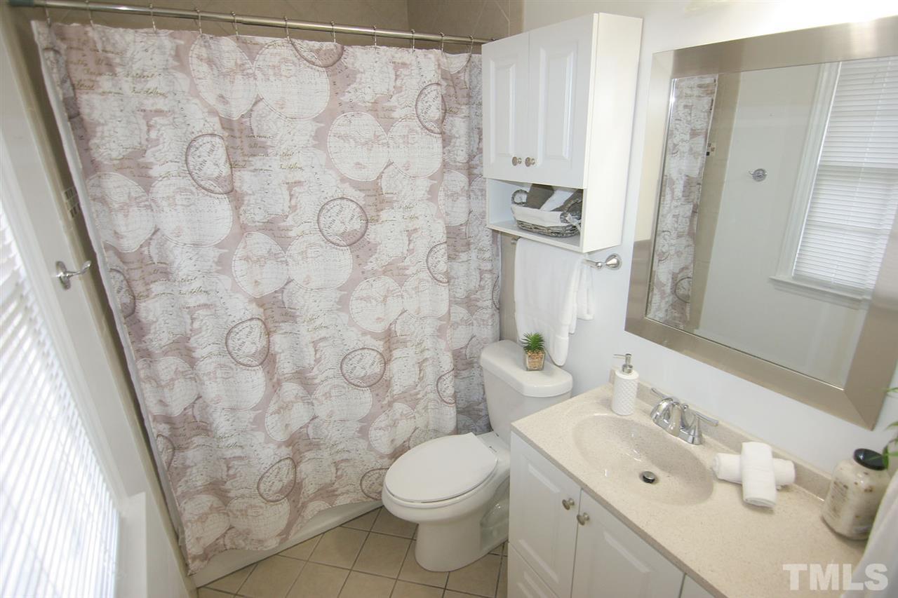 2301 Florida Court Raleigh, NC 27615 - Photo 14 of 20 a bathroom with a sink and a toilet