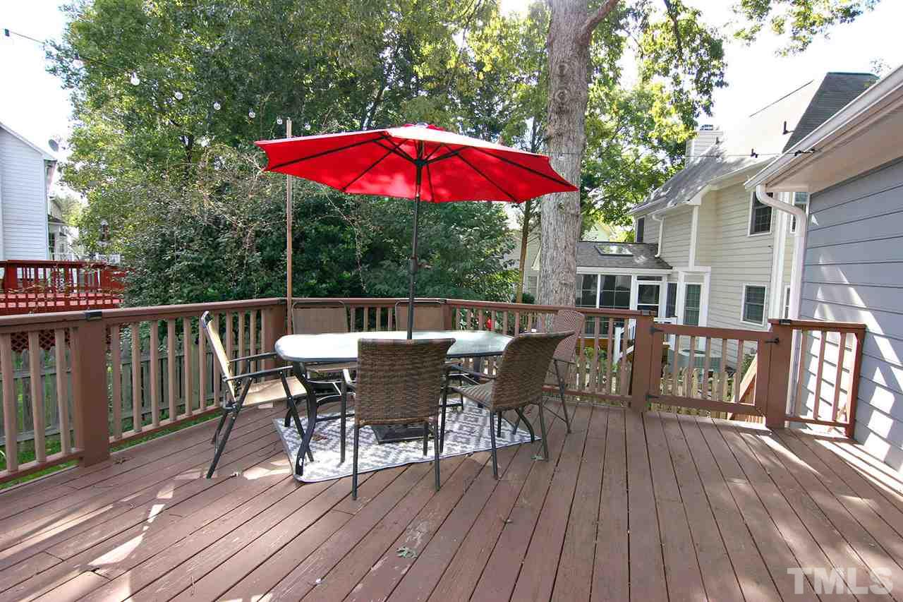 2301 Florida Court Raleigh, NC 27615 - Photo 17 of 20 an outdoor space with furniture and umbrella