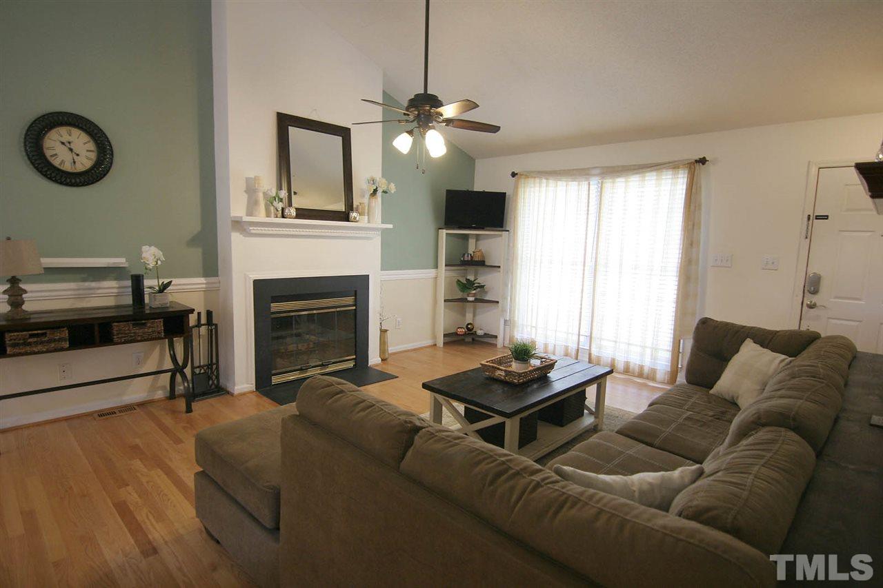 2301 Florida Court Raleigh, NC 27615 - Photo 3 of 20 a living room with furniture a fireplace and a window