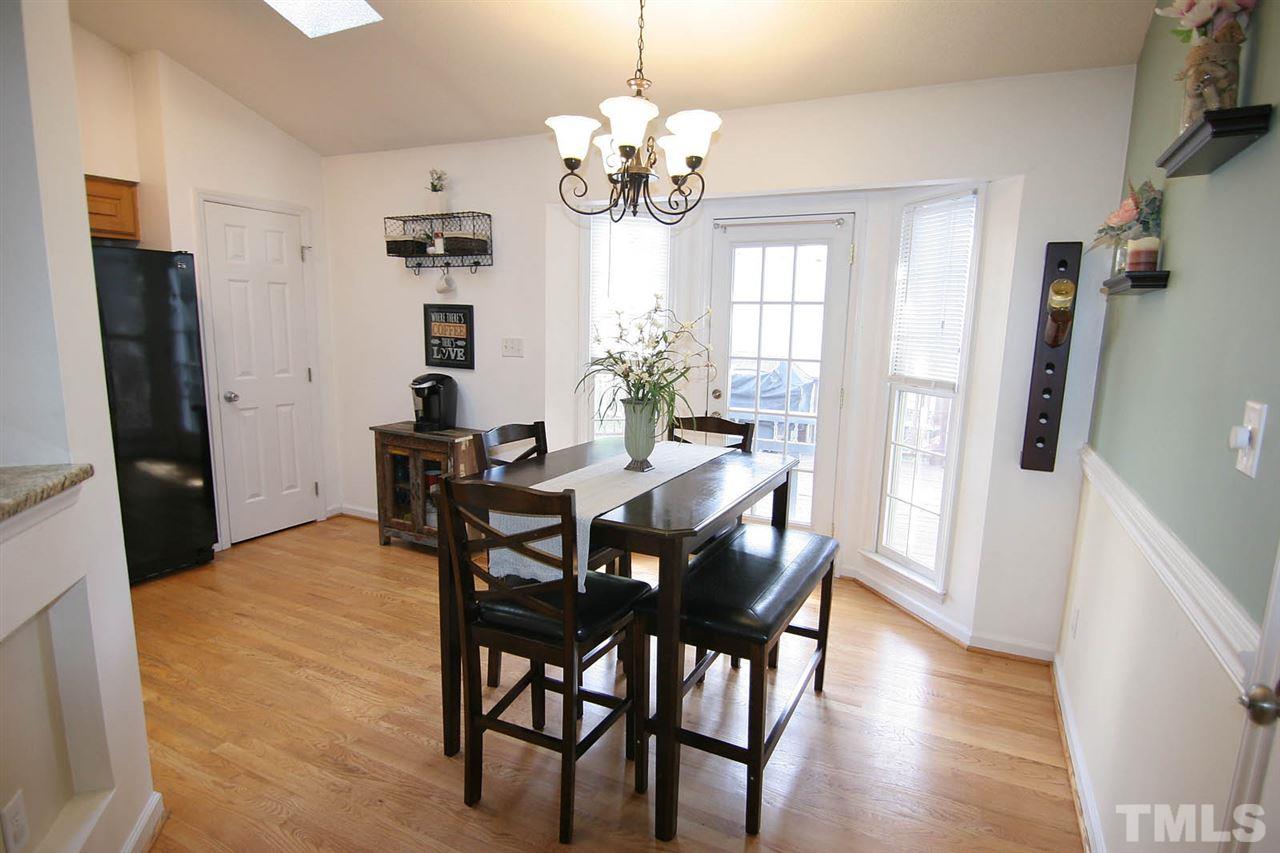 2301 Florida Court Raleigh, NC 27615 - Photo 5 of 20 a view of a dining room with furniture and chandelier
