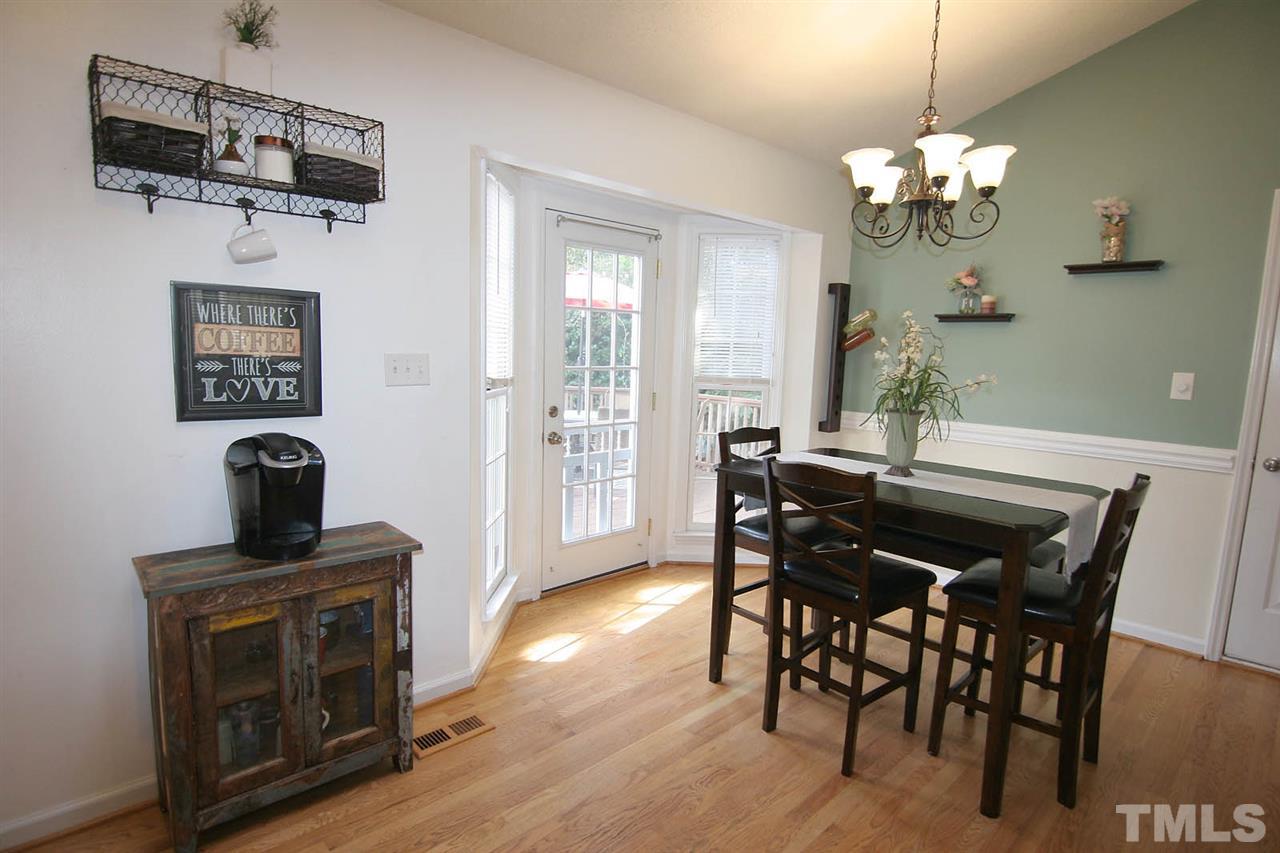 2301 Florida Court Raleigh, NC 27615 - Photo 6 of 20 a view of a dining room with furniture and wooden floor