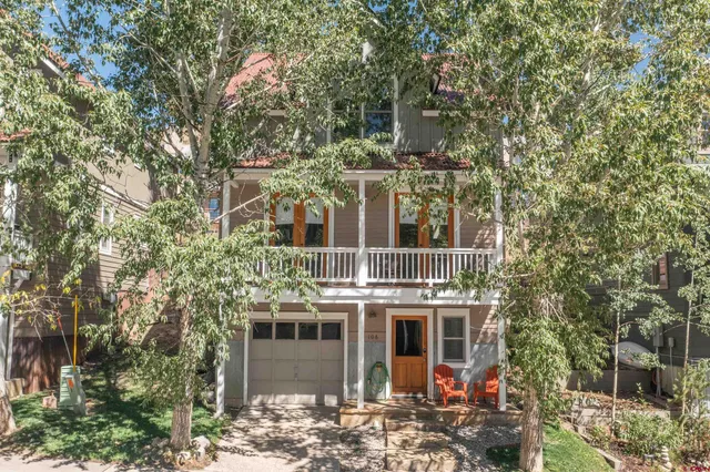 a view of a large building with a tree