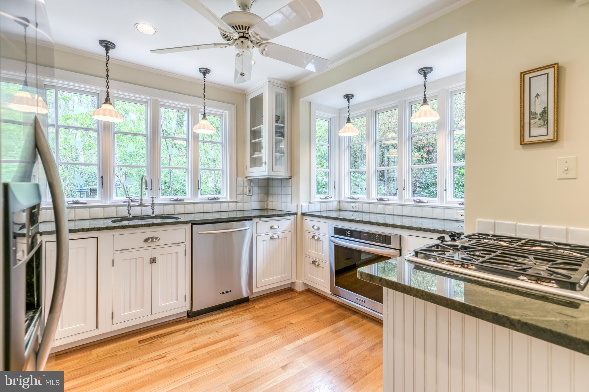 315 Edgevale Road Baltimore, MD 21210 - Photo 13 of 46 Sunny kitchen with granite counters and wood floor