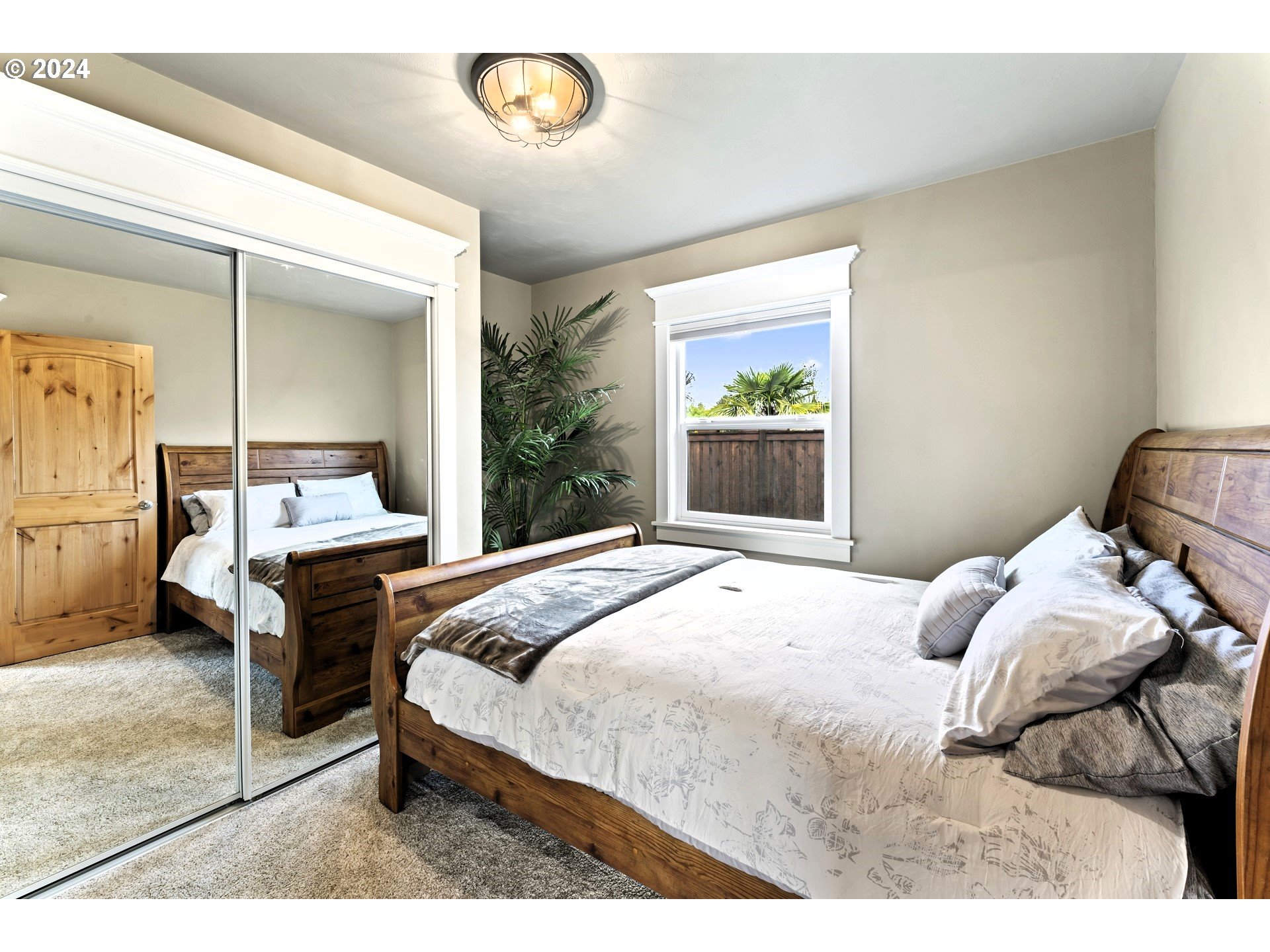 599 River Loop 2 Eugene, OR 97404 - Photo 13 of 25 a bedroom with a bed and a large window